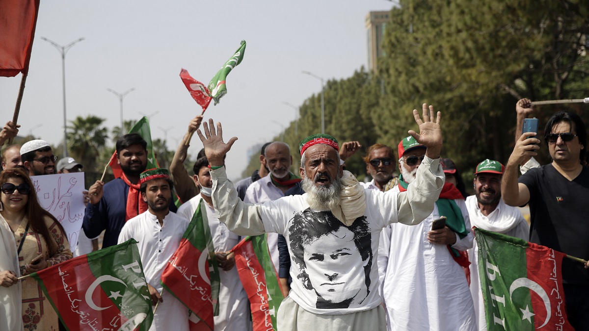 Supporters of ruling party Pakistan Tehreek-e-Insaf (PTI) chant slogans during a protest in Islamabad, Pakistan