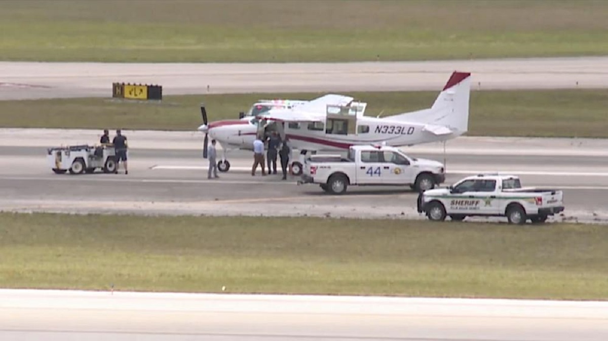 Emergency personnel surround a Cessna plane at Palm Beach International Airport Tuesday