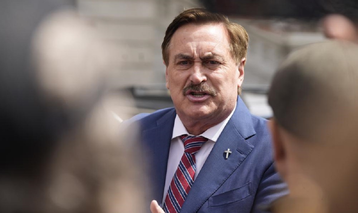 FILE - Mike Lindell, chief executive officer of MyPillow, talks to reporters before attending a rally outside the State Capitol