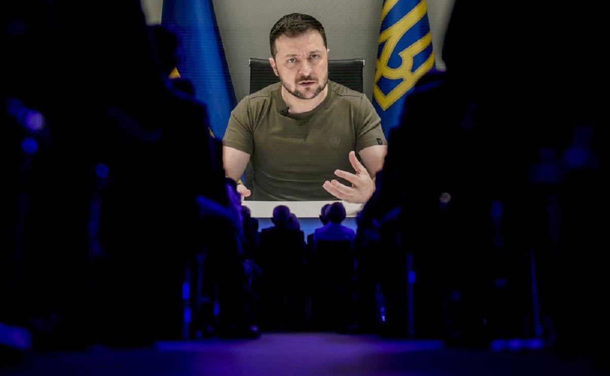 Ukrainian President Zelenskyy displayed on a screen as he addresses the audience from Kyiv on a screen during the World Economic Forum in Davos