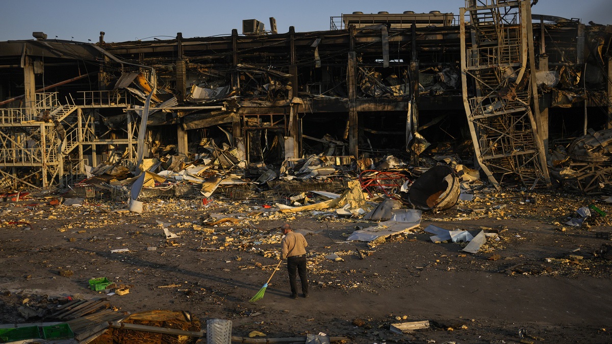 Odessa: A man sweeps rubble next to a shopping and entertainment mall destroyed after a Russian missiles strike on May 9