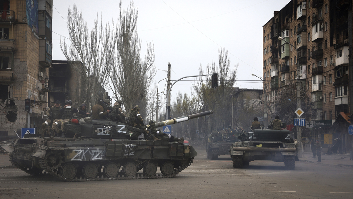 Russian military vehicles move in an area controlled by Russian-backed separatist forces in Mariupol, Ukraine, Saturday, April 23, 2022.&nbsp;