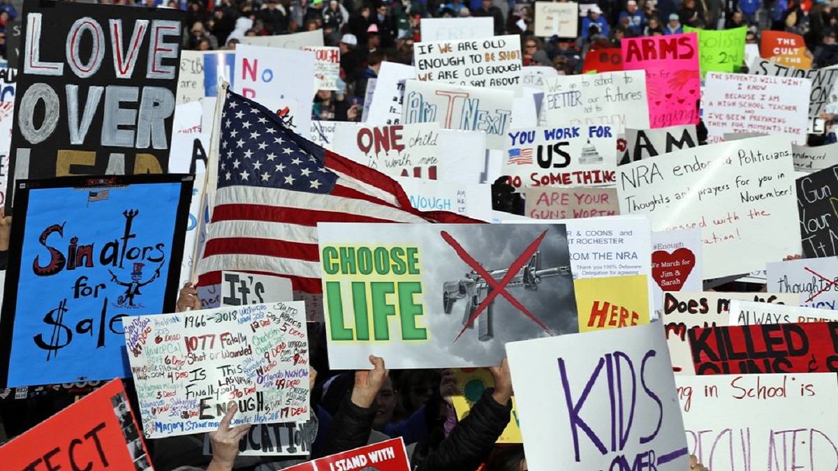 Crowds of people hold signs on Pennsylvania Avenue at the "March for Our Lives" rally in support of gun control, Saturday, March 24, 2018, in Washington.