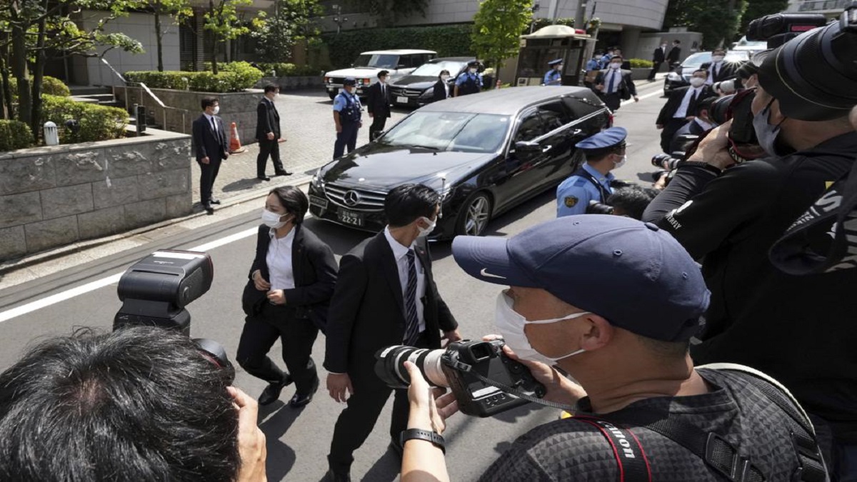 A car which is believed to carry the body of former Prime Minister Shinzo Abe, arrives at his home Saturday, July 9, 2022, in Tokyo.