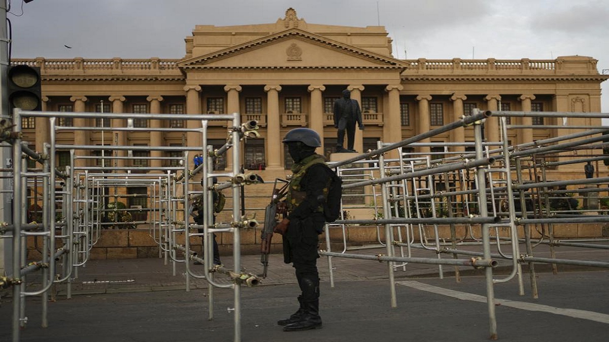 Army soldiers stand guard outside the president's office, after troops and police cleared the main camp of protestors following months of demonstrations, in Colombo, Sri Lanka, Saturday, July 23, 2022.