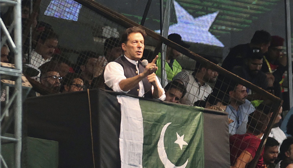 Pakistani opposition leader Imran Khan, center, addresses his party supporters during a rally to press government for fresh elections, in Lahore, Pakistan, Saturday, Aug. 13, 2022.