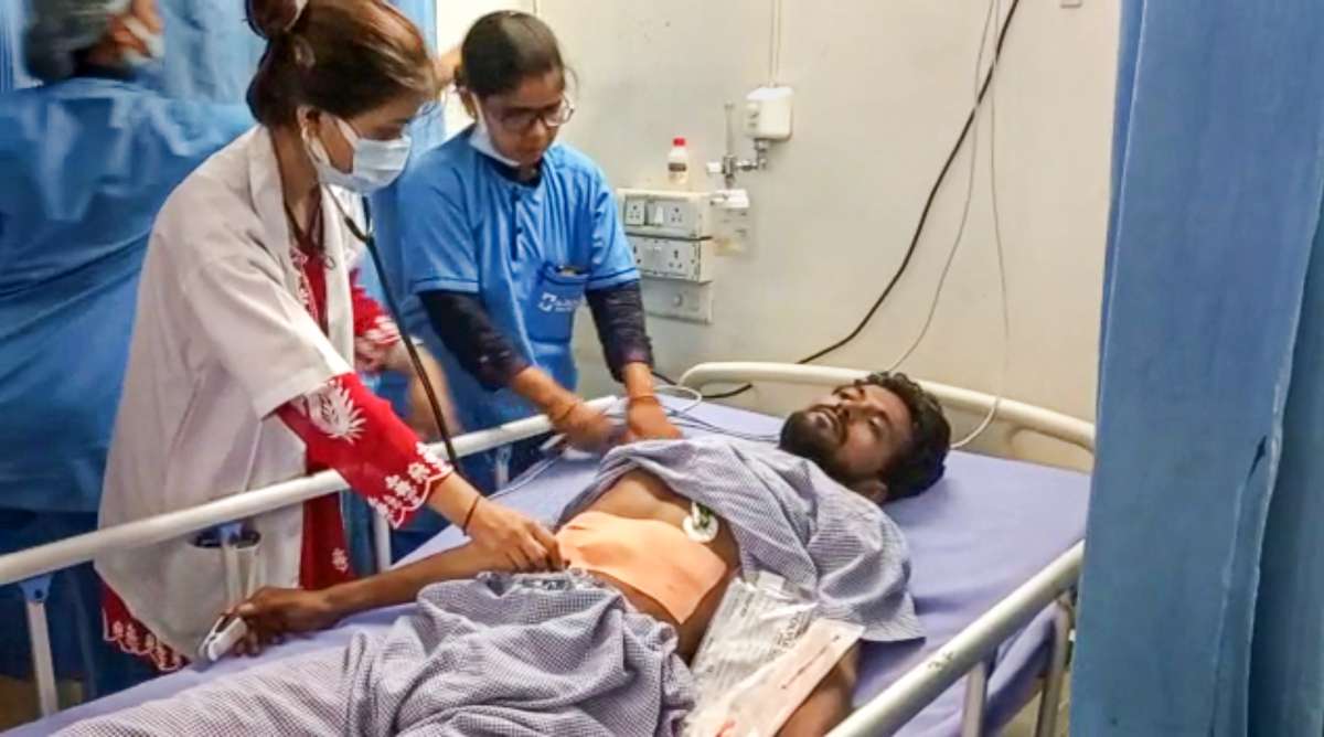 A doctor treats a man injured in a firing by two miscreants on NH 28, at a hospital in Begusarai district