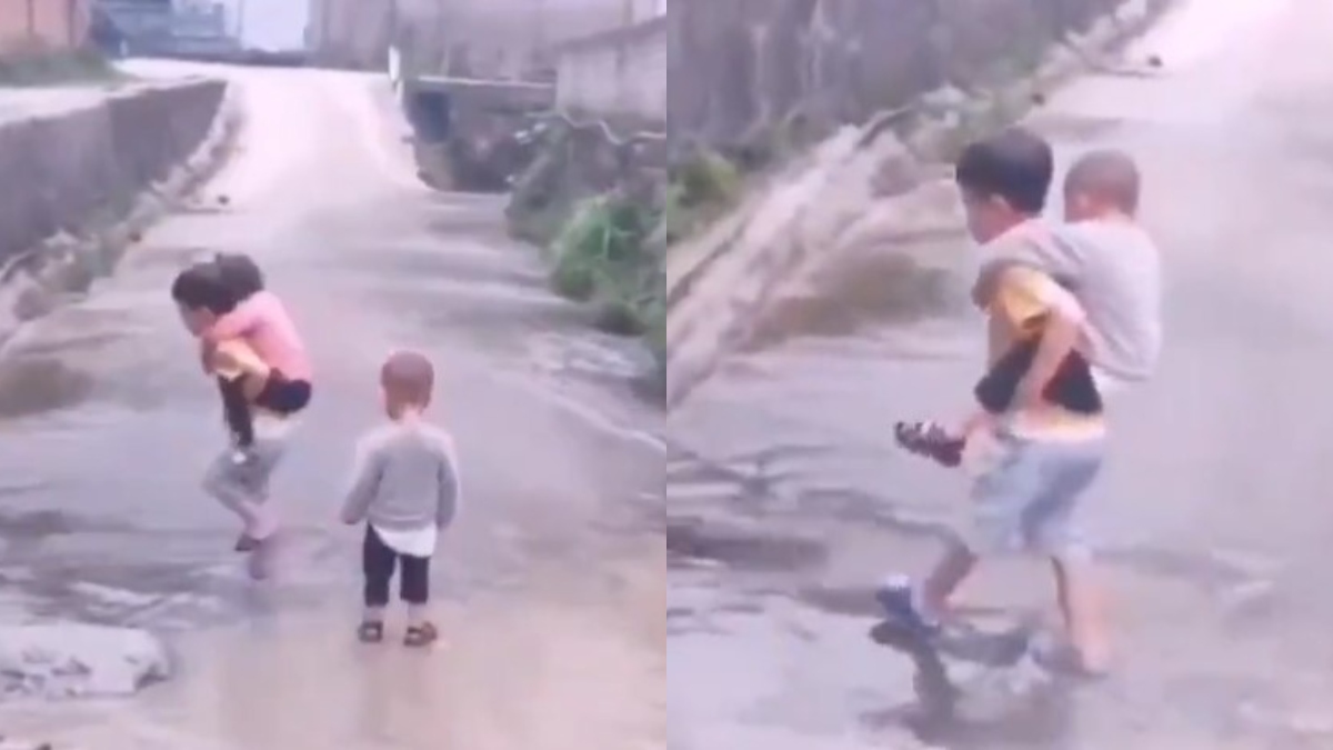 Heartwarming! Kid piggybacks his siblings to cross the waterlogged road | Viral Video