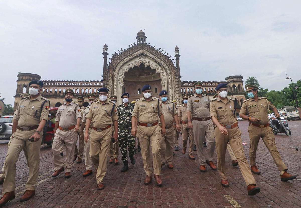 Police personnel during a flag march on the eve of Eid al-Adha, in Lucknow.