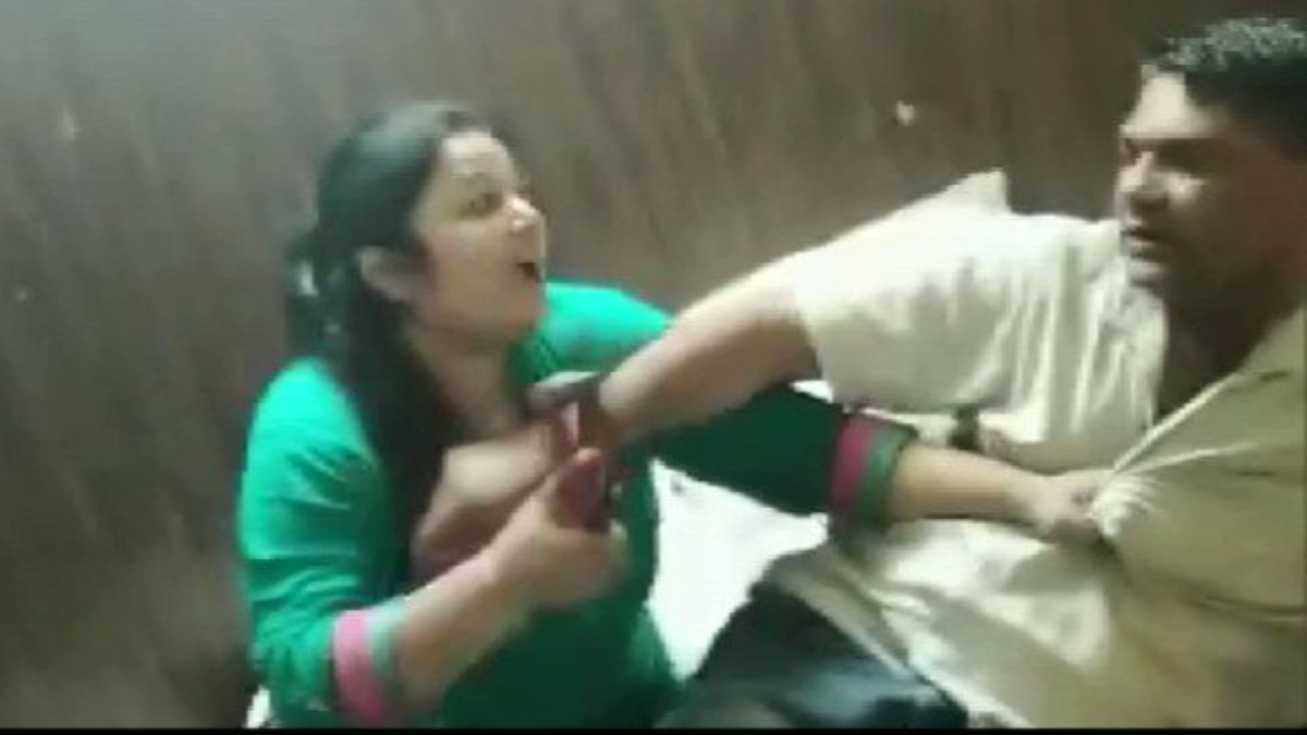 Viral video Fuming woman beats husband with slippers after she catches him with his lover in Agra hotel Trending News image image