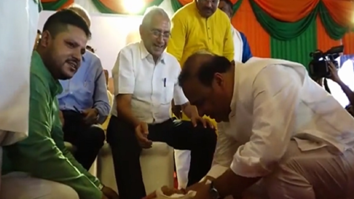 Assam CM Himanta Biswa Sarma washes feet of senior BJP workers in Guwahati | WATCH