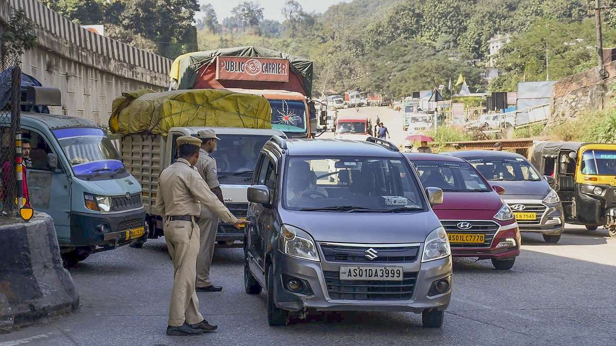 Jorabat: Assam Police personnel stop Meghalaya-bound vehicles for safety reasons, a day after violence at a disputed Assam-Meghalaya border 