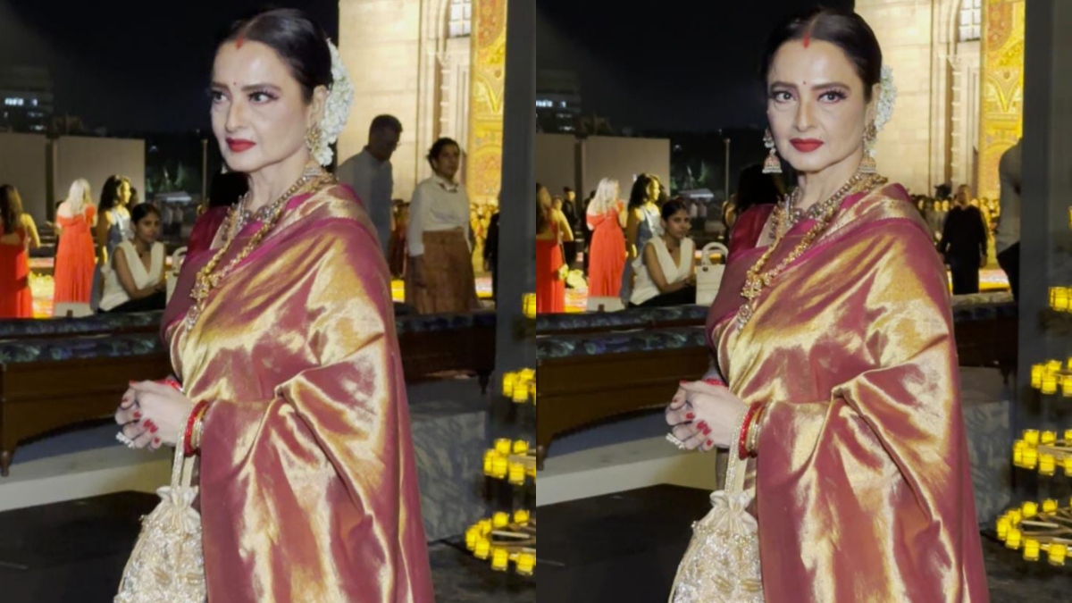 Rekha looks ethereal in red saree; as she poses in front of Gateway Of India. See pics