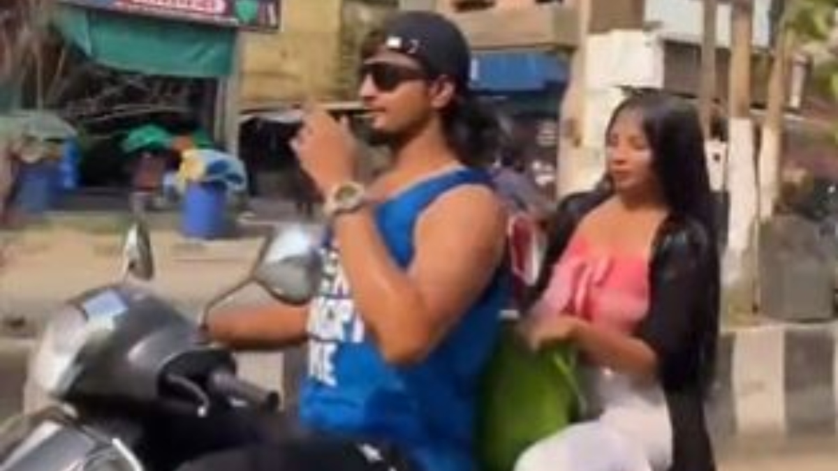 Couple takes bath on a scooter in Maharashtra. Video goes viral