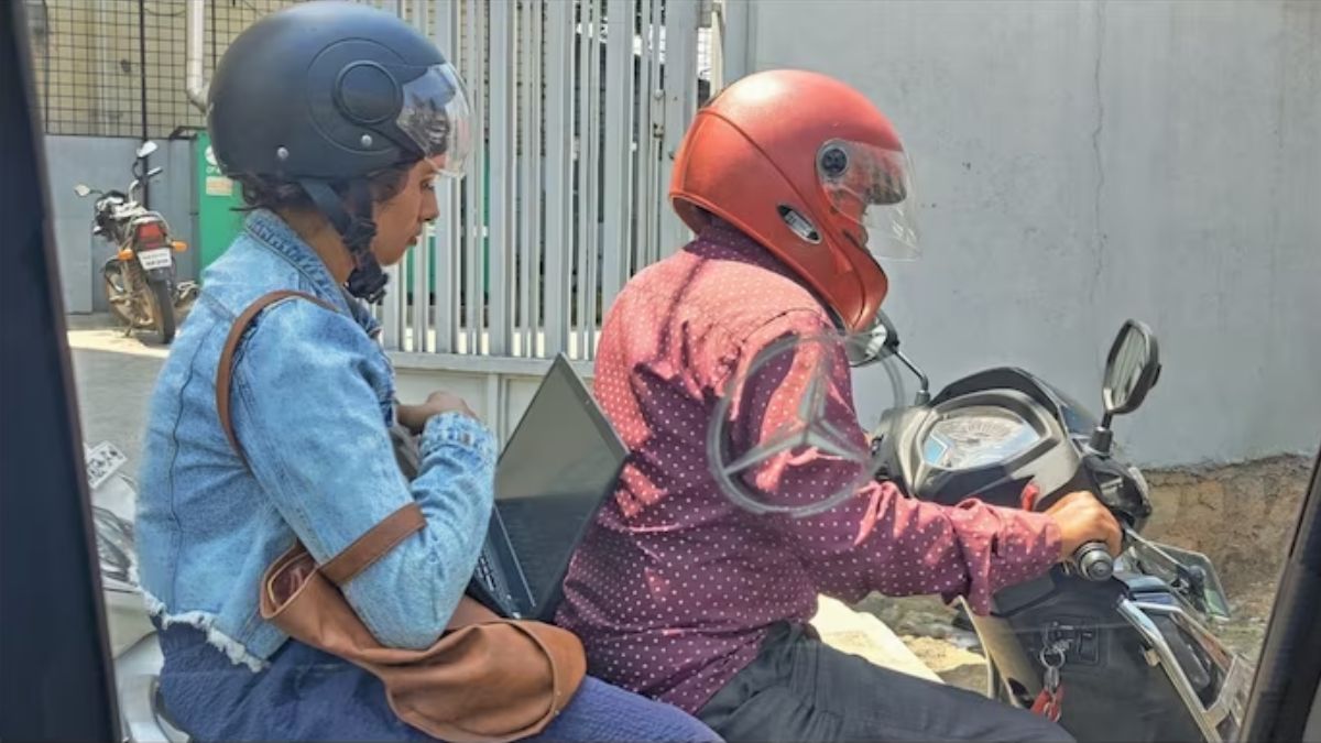 Bengaluru woman works on laptop while riding Rapido bike stuck in traffic, pic goes viral