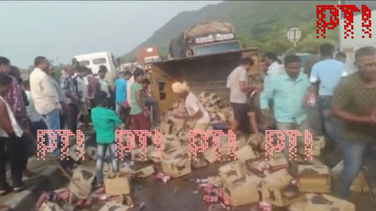 Andhra Pradesh: Van carrying beer bottles overturns; Here's what happened next | WATCH