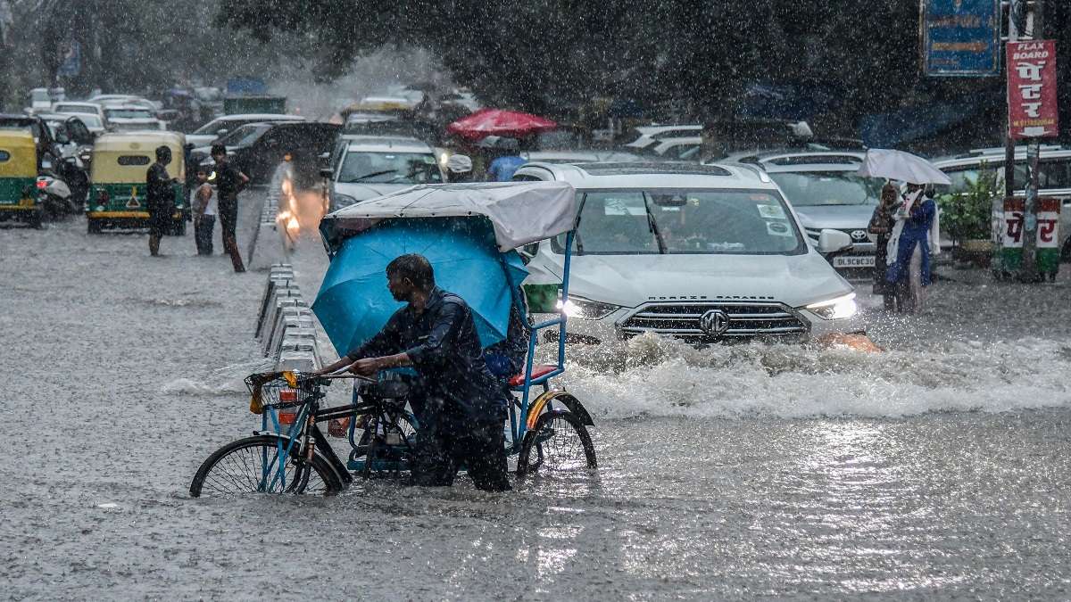 Delhi Weather Heavy Rain Triggers Waterlogging Traffic Congestion IMD 