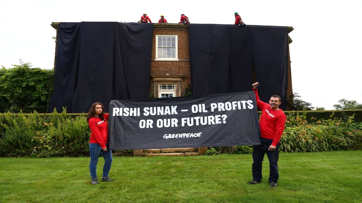 UK PM Rishi Sunak's house draped in black by Greenpeace demonstrators to protest oil expansion plans