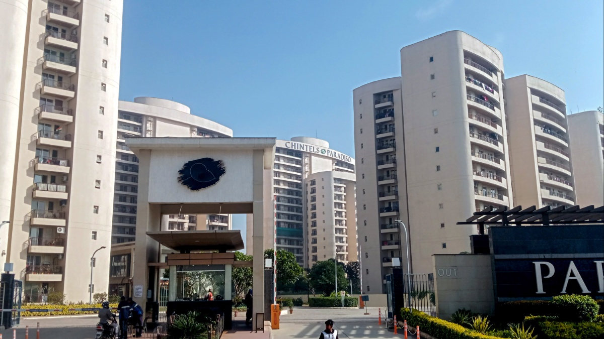 A resident with his pet dog at a Housing Complex.
