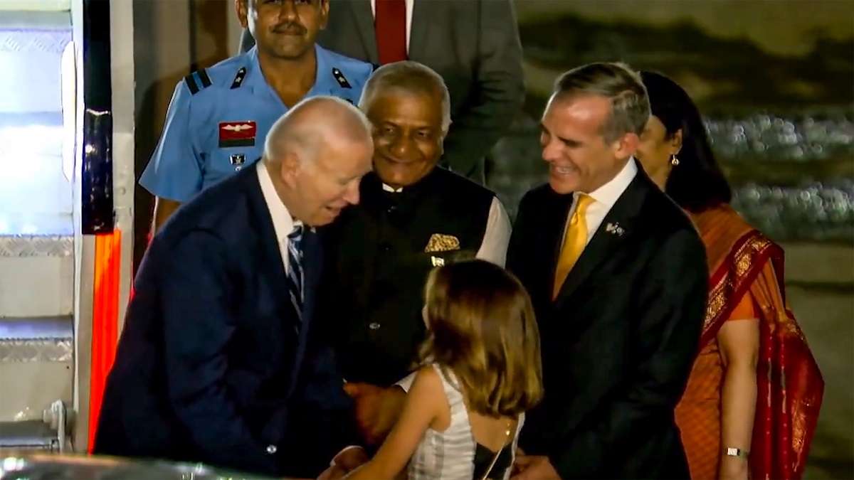 Joe Biden waves at folk dancers meets US Ambassador daughter VK Singh airport video G20 Summit New Delhi latest news