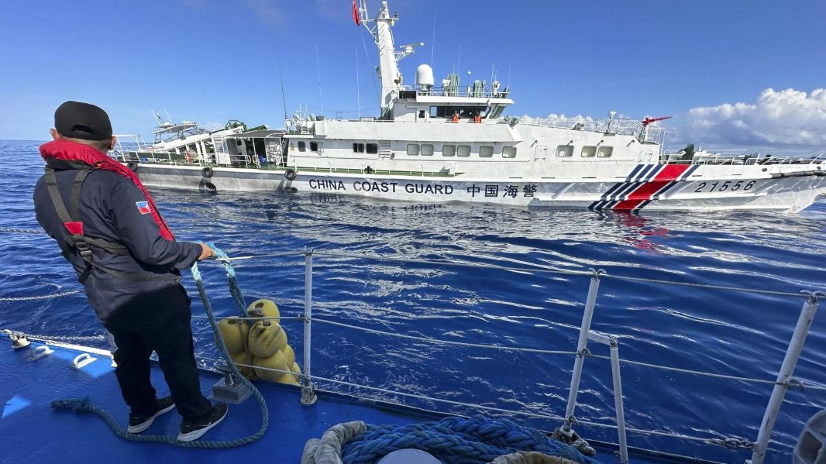 Dozens of Chinese ships chase Philippine vessels as US renews warning