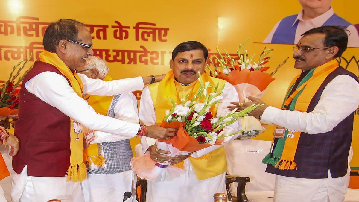 Madhya Pradesh CM-designate Mohan Yadav being greeted by outgoing Chief Minister Shivraj Singh Chouhan and state President VD Sharma in Bhopal on Monday. 