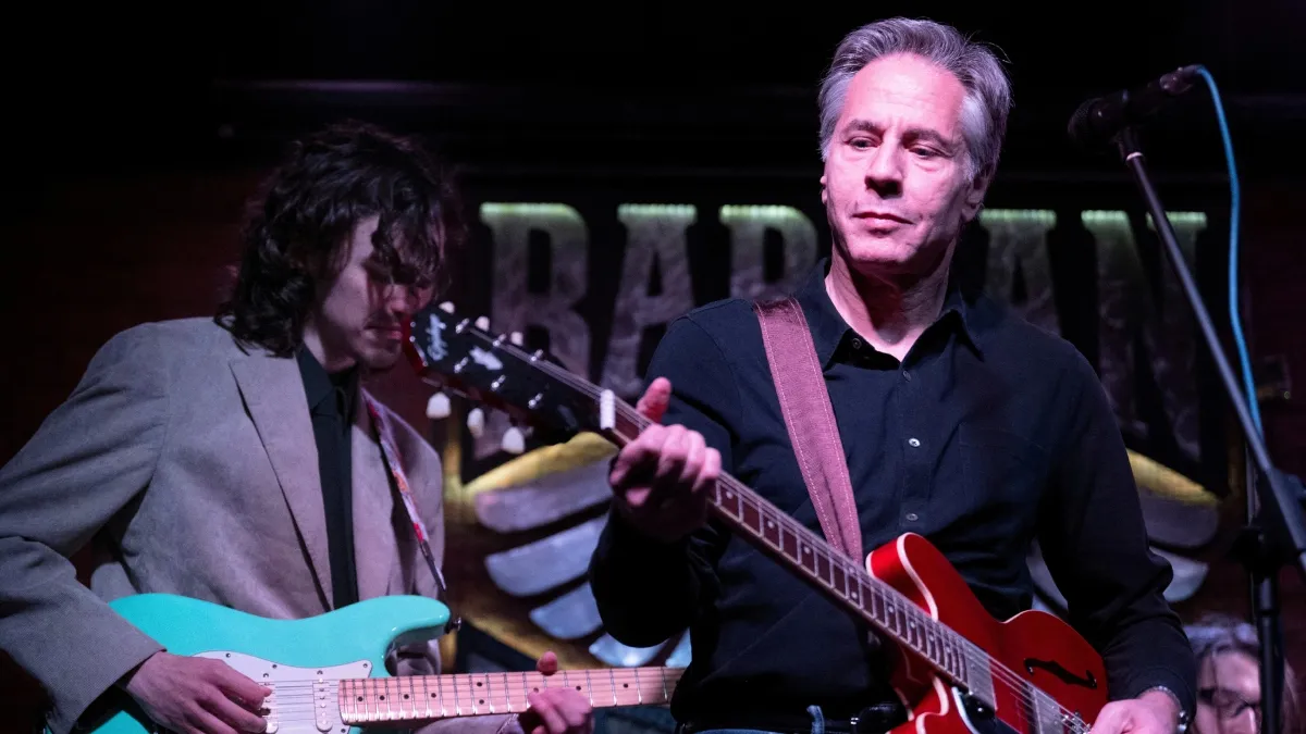 Blinken playing 'Rockin' in the Free World' at a basement bar in Kyiv.