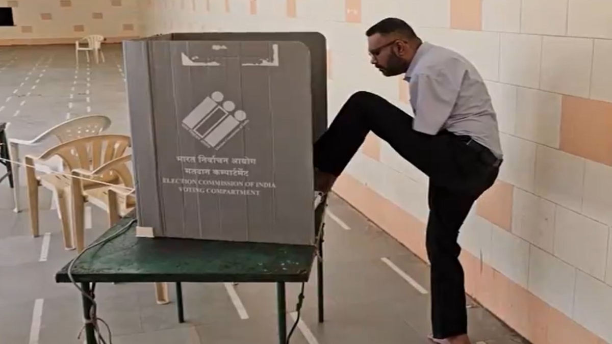 Inspiration! Voter who lost both hands 20 years ago casts vote through feet in Gujarat’s Nadiad | VIDEO