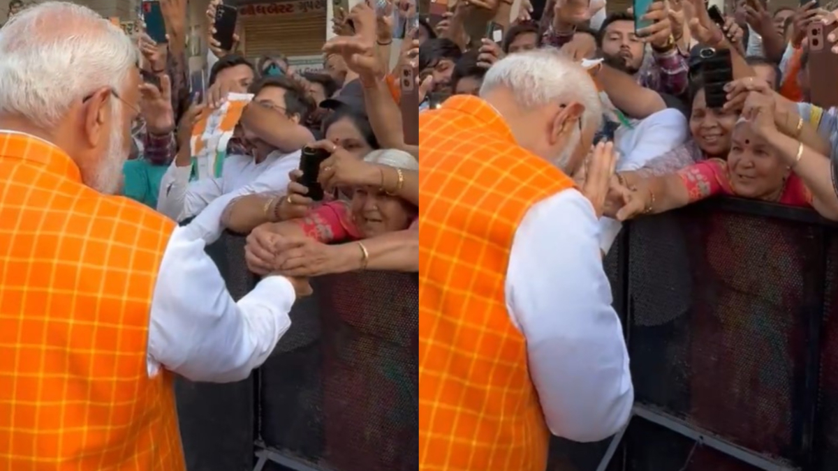 Elderly woman ties rakhi to PM Modi as he greets people after casting vote in Ahmedabad | WATCH