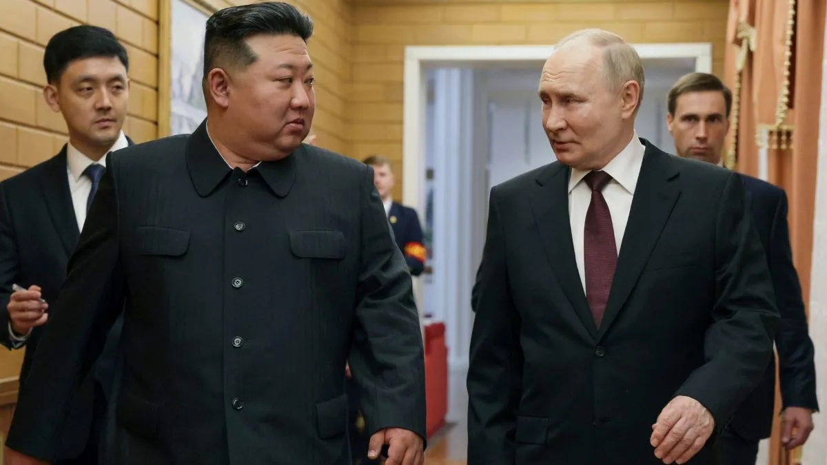 Russian President Vladimir Putin talks with North Korean leader Kim Jong Un during his visit to Pyongyang, North Korea