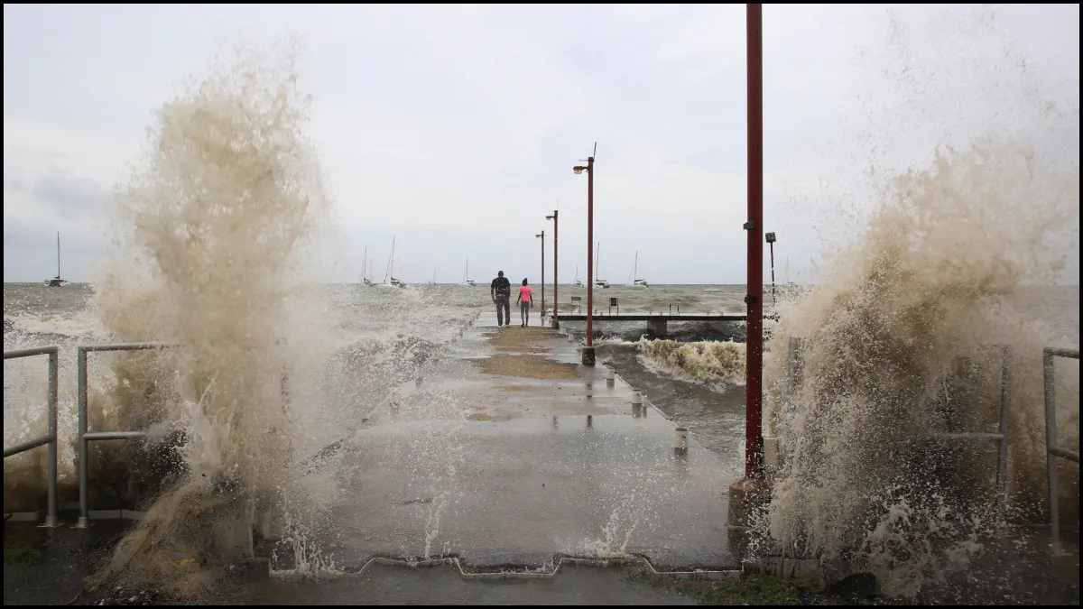 Waves crash into a pier after Hurricane Beryl made landfall.