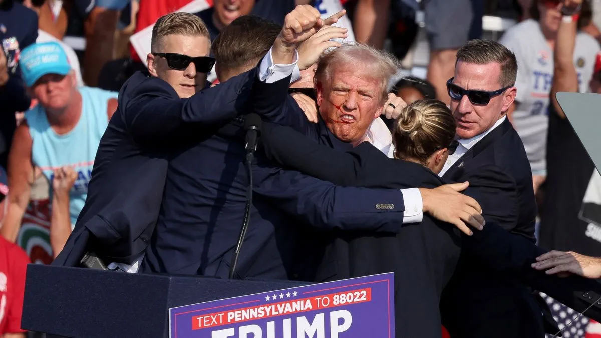 Republican presidential candidate former President Donald Trump is helped off the stage at a campaign event in Butler. Iran rejects involment in Trump attack