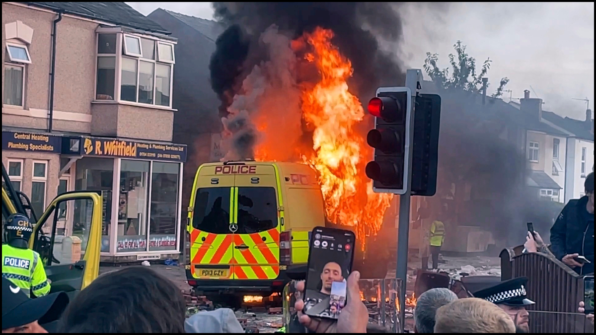 UK: Protesters clash with police, hurl stones and torch cars, after 3 girls stabbed to death | WATCH