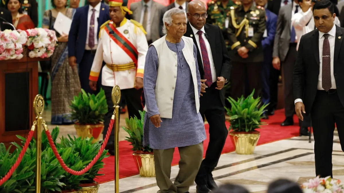 Nobel laureate Muhammad Yunus walks off the stage after taking oath at the Bangabhaban as the head of the interim government, in Dhaka.