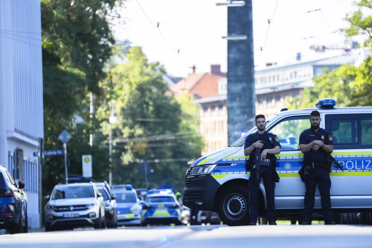 Police officers block a street after police fired shots at a suspicious person near the Israeli Consulate and a museum on the city's Nazi-era history in Munich, Germany