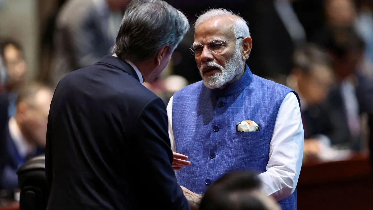  Prime Minister Narendra Modi speaks to U.S. Secretary of State Antony Blinken as they attend the 19th East Asia Summit (EAS) at the National Convention Centre, in Vientiane, Lao