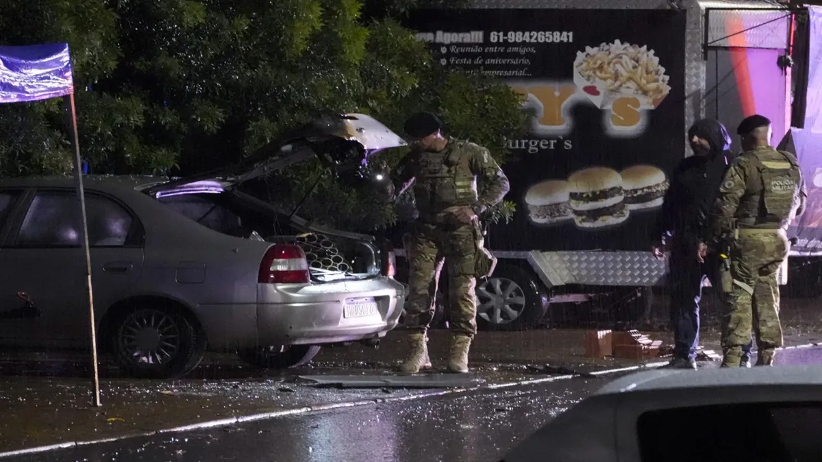Police inspect a vehicle outside the Supreme Court in Brazil. 
