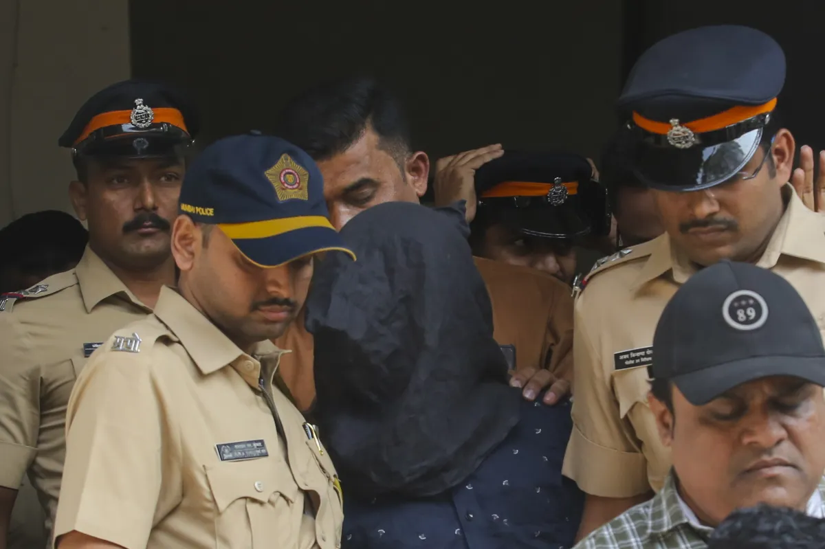 Police personnel take the accused, arrested in connection with the alleged attack on Bollywood actor Saif Ali Khan, to a hospital for medical examination before producing him at a court, in Mumbai.