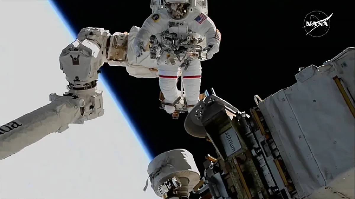 NASA astronauts, awaiting return after delay, conduct joint spacewalk