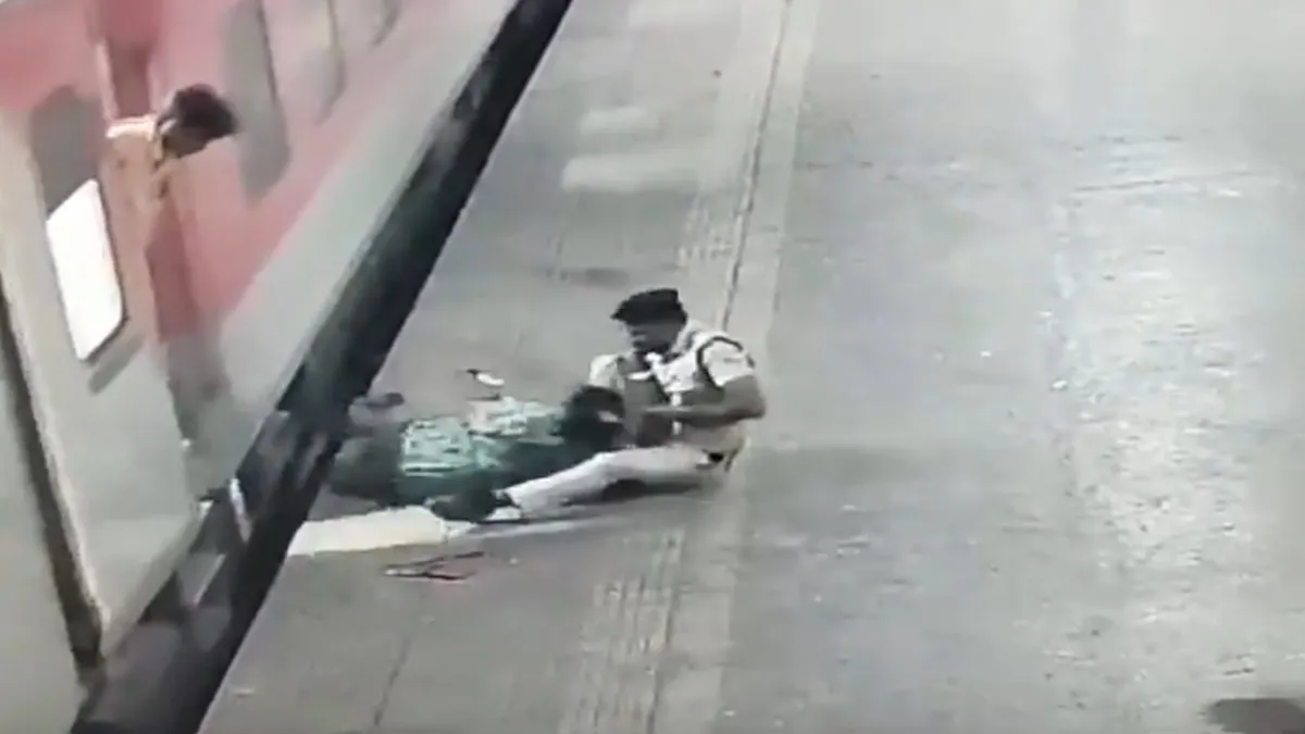 Railway police save woman from being dragged under moving train at ...