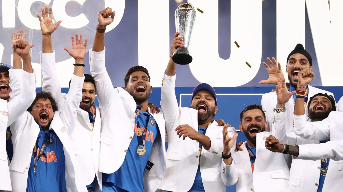 Rohit Sharma and Virat Kohli celebrate the Champions Trophy win with teammates.