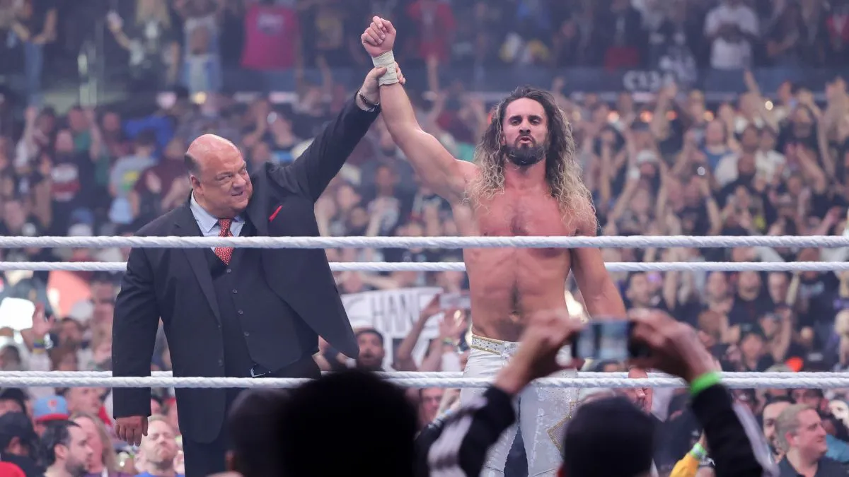 Paul Heyman and Seth Rollins