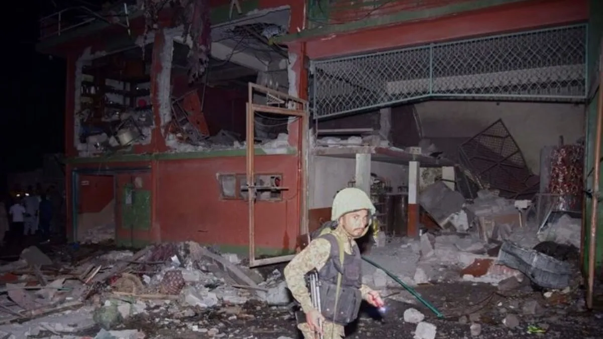 An army soldier examines a building damaged by Indian missile attack near Muzaffarabad, the capital of Pakistan-controlled Kashmir, on Wednesday, May 7, 2025. 