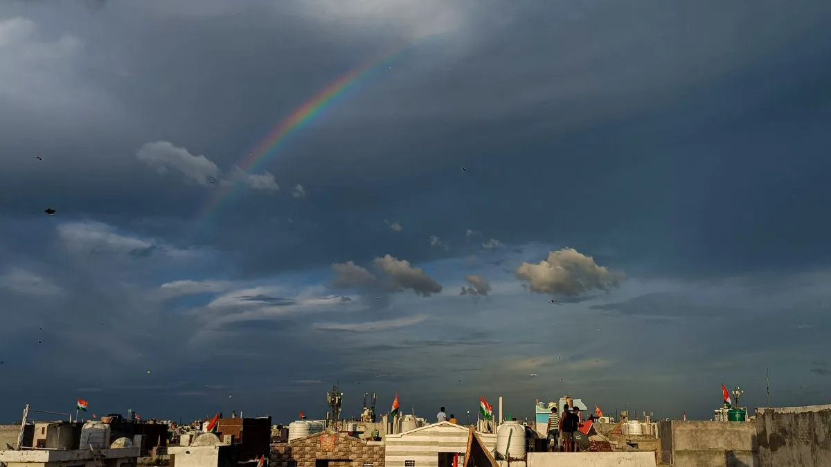 A rainbow appears in the sky following rainfall in Delhi
