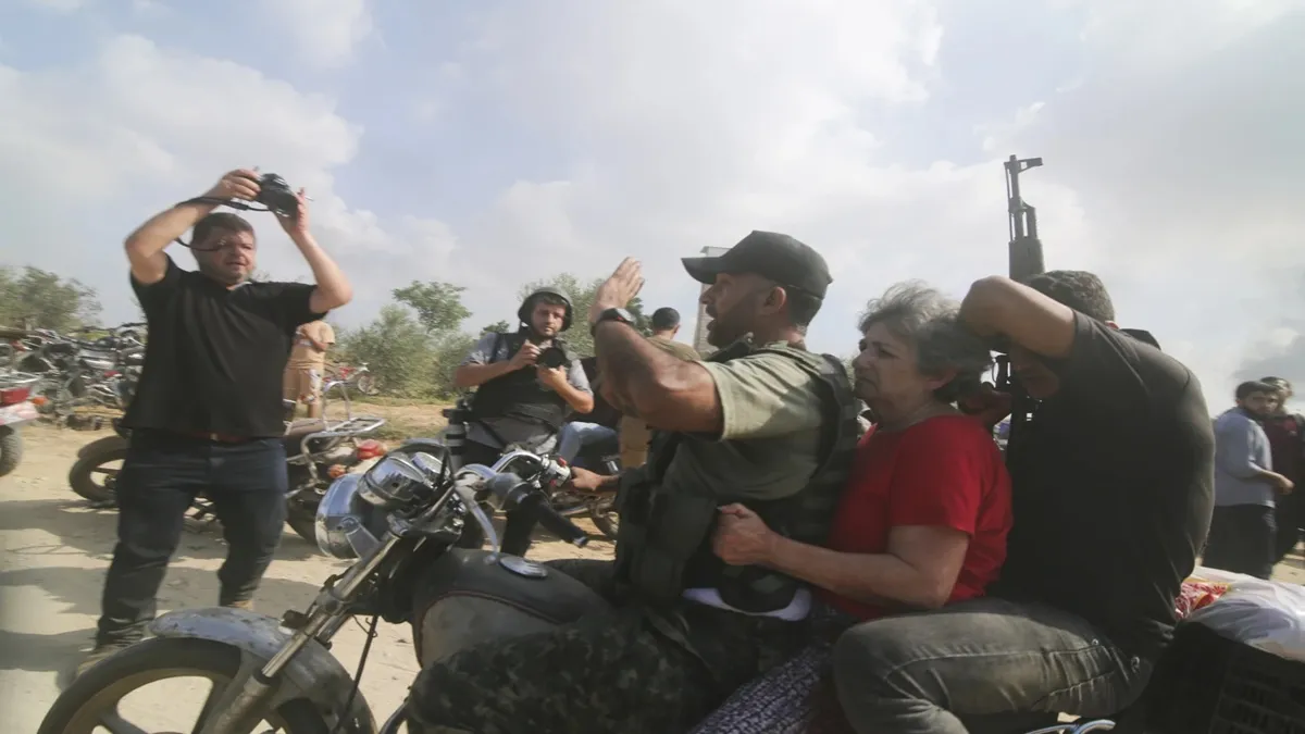 Hamas militants transport Adina Moshe inside the Gaza strip after kidnapping her. 