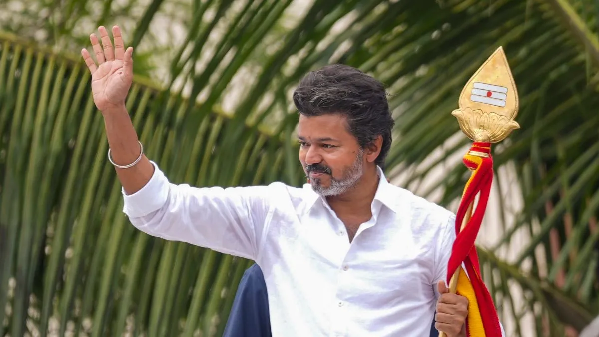 Tamilaga Vettri Kazhagam (TVK) founder Vijay greets people during a public rally,