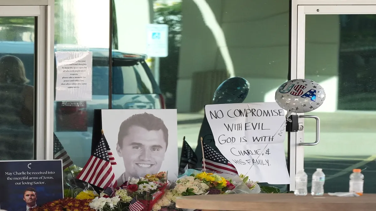 Well-wishers pay their respects to Charlie Kirk at a makeshift memorial at the national headquarters of Turning Point USA.