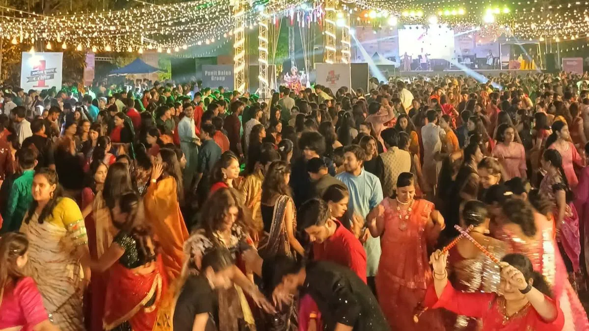 Devotees and dancers gather in huge numbers to celebrate Navratri with Garba and Dandiya in Ahmedabad, creating a vibrant festive atmosphere.