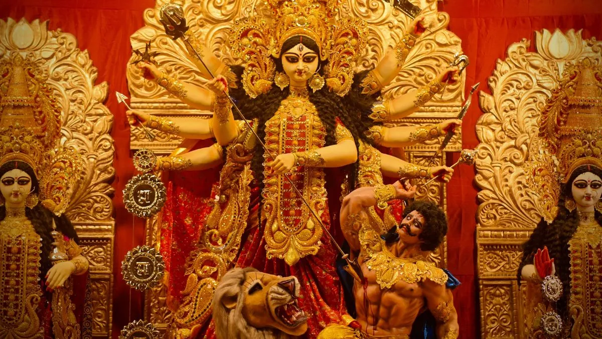A grand Durga idol depicting the victory over Mahishasura, worshipped during Maha Panchami 2025