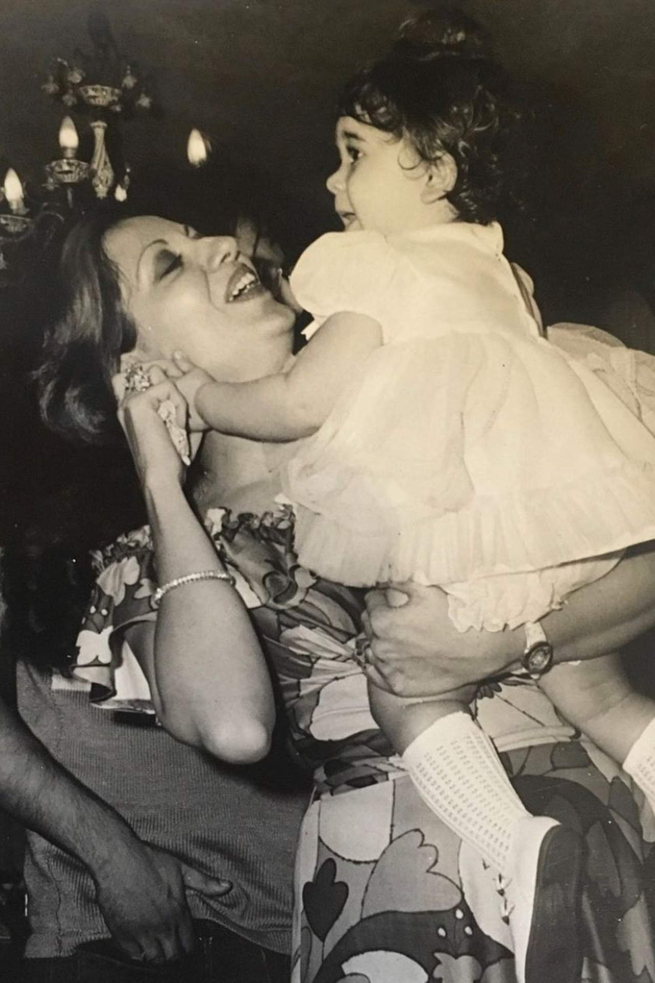 Little Karisma looks adorable as she dances in her mother&amp;rsquo;s arms.